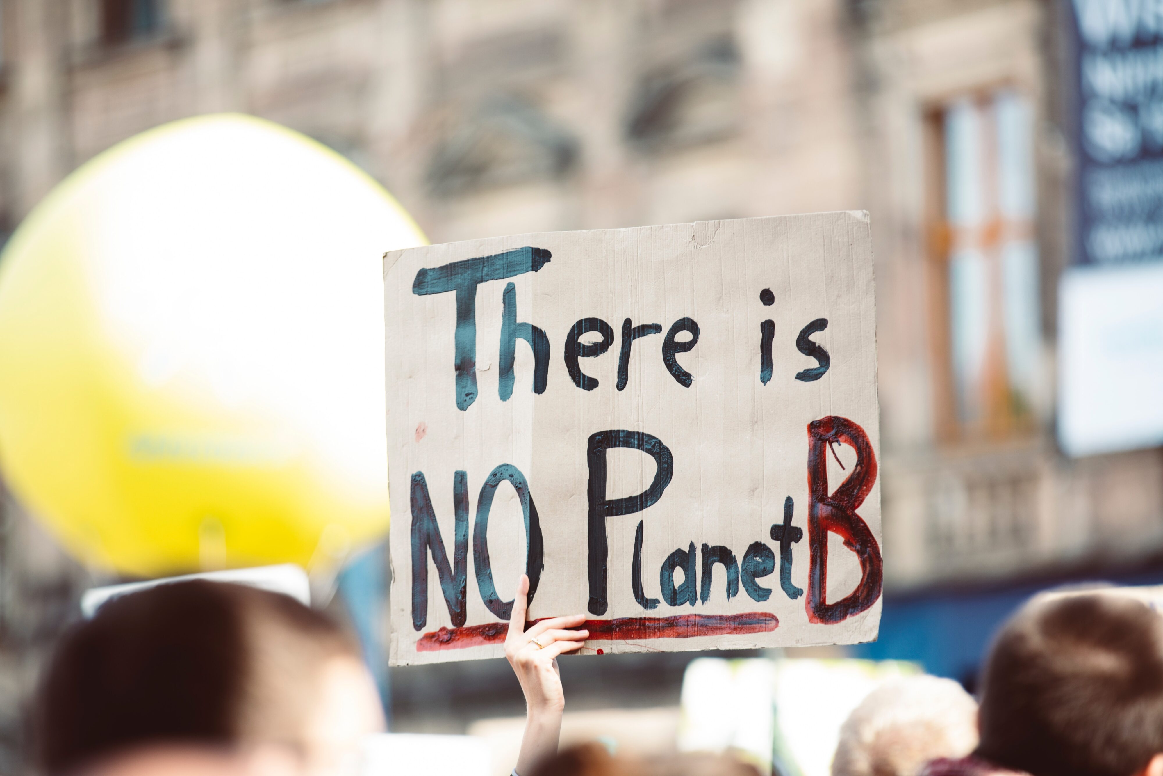 A protest placard reading